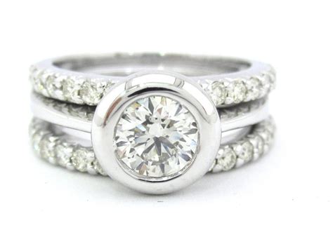 Round diamond bezel set engagement ring and bands by KNRINC