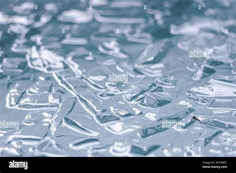 Cold water and ice cubes melting background. Global warming or climate change concept. Cold ...