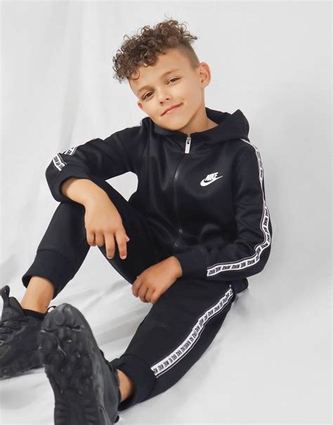 Buy Black Nike Repeat Tape Poly Full Zip Tracksuit Children | JD Sports | JD Sports Ireland