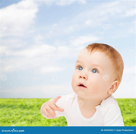 Curious Baby Lying on Floor and Looking Up Stock Image - Image of blue ...