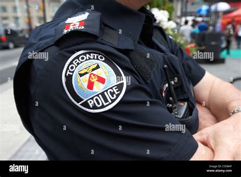 badge on uniform of toronto police officer toronto ontario canada Stock Photo - Alamy