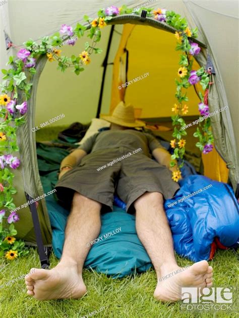 Man sleeping in tent with hat on face, Stock Photo, Picture And Royalty ...