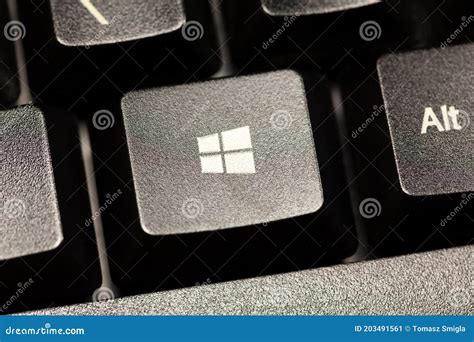 Microsoft Windows 10 Operating System Logo Key on a Black Desktop ...