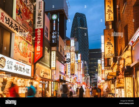 Shinjuku, Tokyo, Kanto region, Japan. Illuminated neon signs at dusk ...