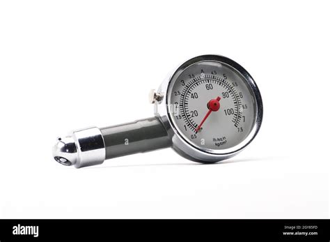 Pressure gauge for measuring air pressure in automobile tires close-up on an isolated white ...