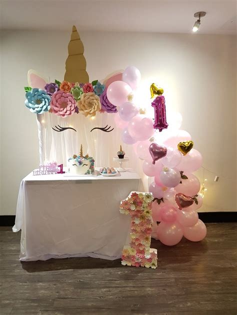 Unicorn set-up for a sweet first birthday party | First birthday party ...