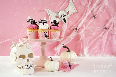 On trend pink Halloween party table with cupcakes Photograph by ...