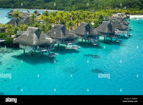 Overwater bungalows of Hilton bora Bora Nui Resort hotel in Bora bora Island Stock Photo - Alamy