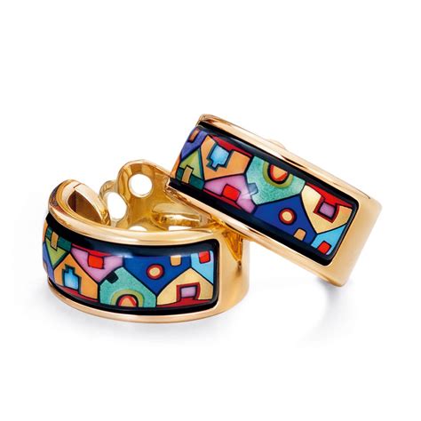 two gold rings with colorful designs on them