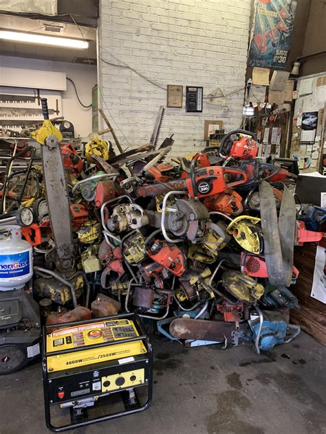 Lawn Mower repair place near me has a pile of discarded chainsaws. : r/mildlyinteresting