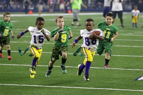 A flag football game as part of the Play 60 program for children at ...