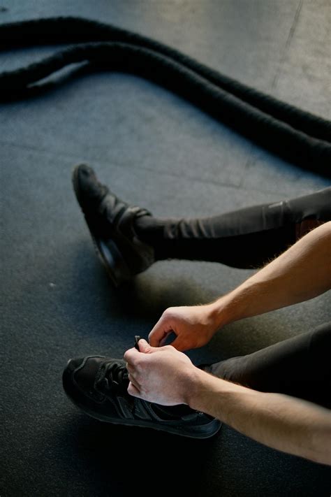 Person Tying Shoes · Free Stock Photo