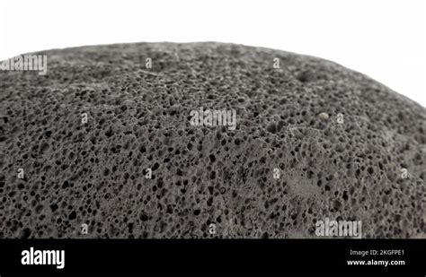 Scoria rock surface texture extreme close up against white background stock Stock Video Footage ...