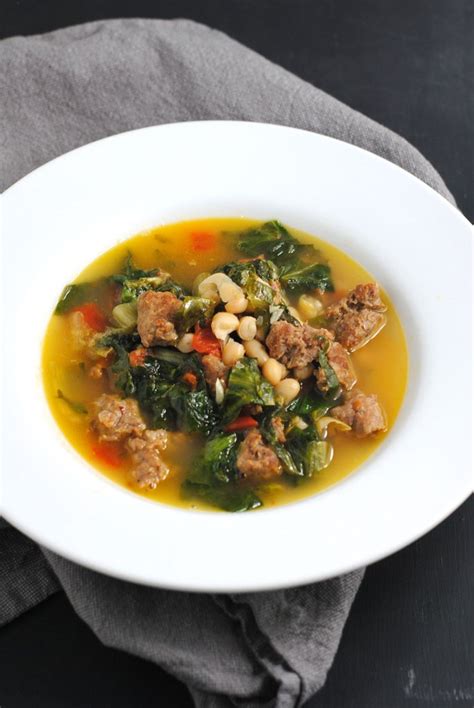 Escarole soup with sausage and beans | white plate blank slate