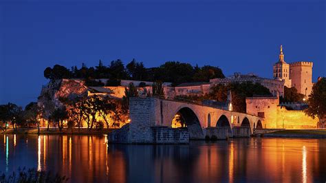 The Papal Palace and the Saint-Benezet Bridge at Night. Avignon, France Photograph by Sergey Tubin