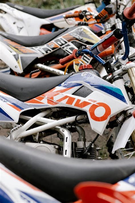 Orange and White Dirt Bike in Close Up Shot · Free Stock Photo