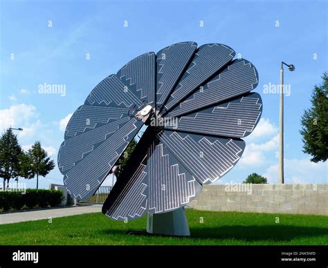 Circular flower shaped rotating solar panel system. tracing the sun`s movement. Intelligent and ...