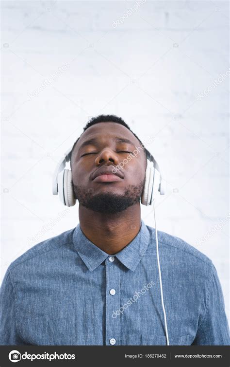 Young Man Listening Music Headphones — Free Stock Photo © AndrewLozovyi #186270462