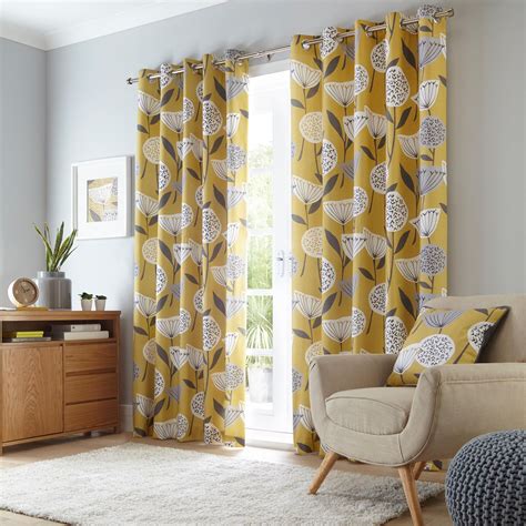 Elements Emmott Ochre Eyelet Curtains | Yellow walls living room, Pattern curtains living room ...