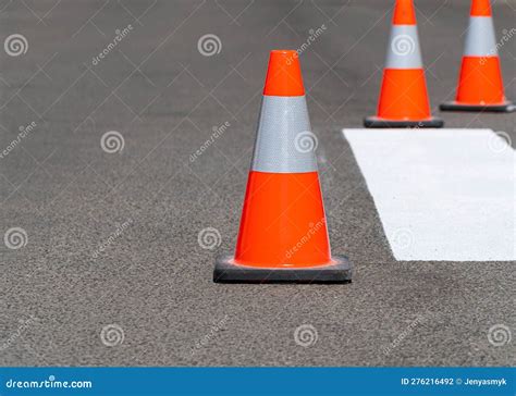 Road Traffic Cones Standing on Street on Gray Asphalt during Road Construction Works. Traffic ...