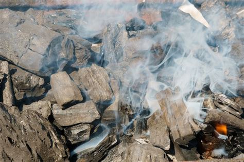 Premium Photo | Glowing coals in a barbeque grill coal fire smoke