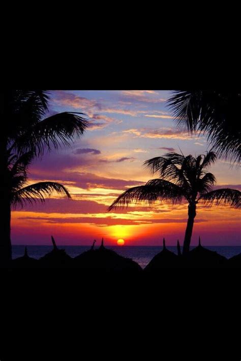 Sunset in Aruba | Beautiful places to visit, Dream vacations, Places to ...