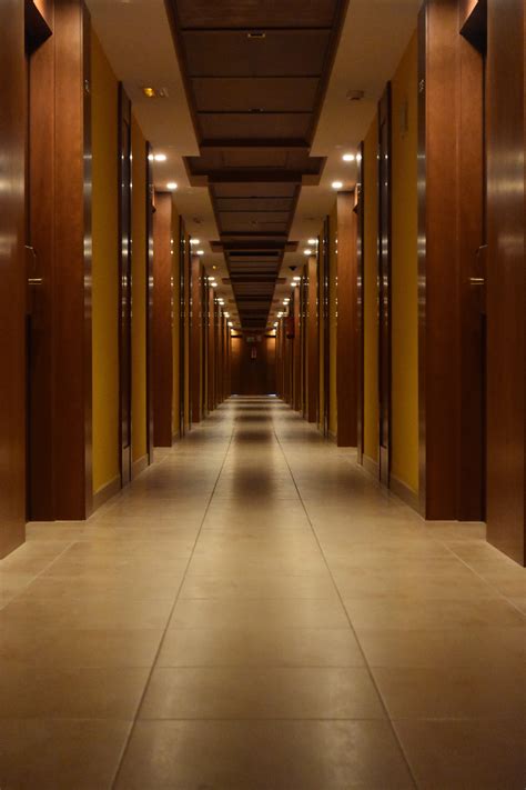 Beige Ceramic Tiled Corridor Inside Building · Free Stock Photo