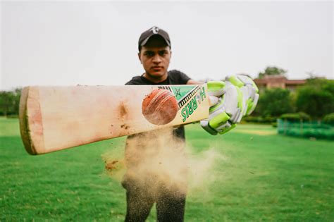 Male cricket player hitting ball · Free Stock Photo