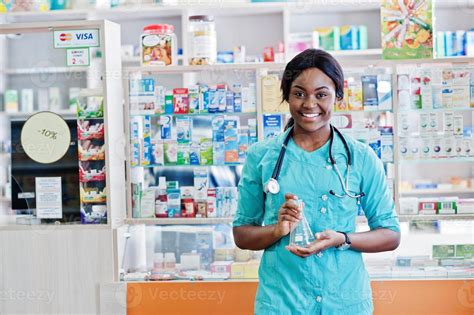 African american pharmacist working in drugstore at hospital pharmacy ...