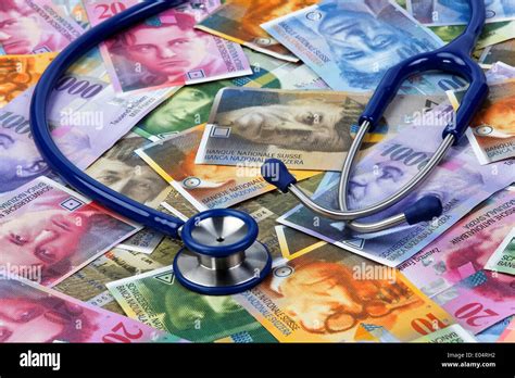 Swiss francs and stethoskop ace a symbol for health costs hi-res stock photography and images ...