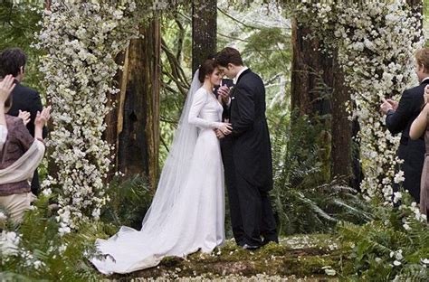 Breaking Dawn Twilight Wedding- flower-adorned wedding ceremony arbor | OneWed.com