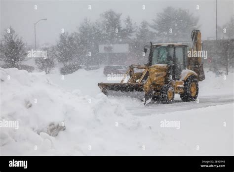 NORWALK, CT, USA-FEBRUARY 1, 2021: Snow plow machinery during snow ...