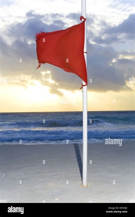 Red flag on the beach Stock Photo - Alamy