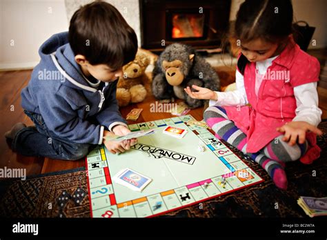 Children play Monopoly Stock Photo - Alamy