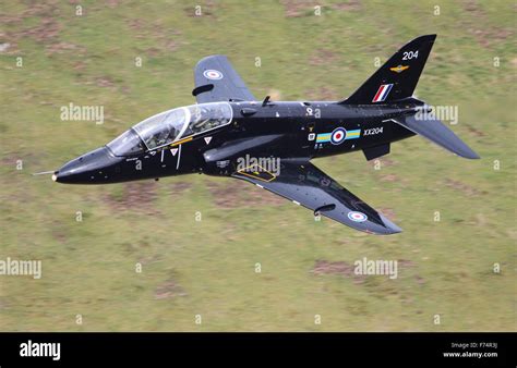 RAF Hawk T1 jet training aircraft on a low level flying exercise in the Mach Loop, Wales, UK ...