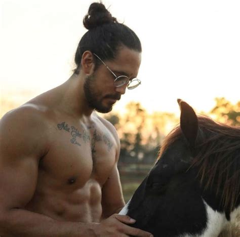 Man Buns & Manes of the horsey kind! Stunning shot from @a_digital_nomads_life 🦁🐴 ...