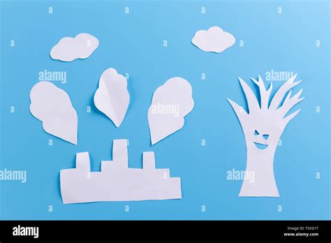 paper factory on blue background. environmental pollution concept Stock Photo - Alamy