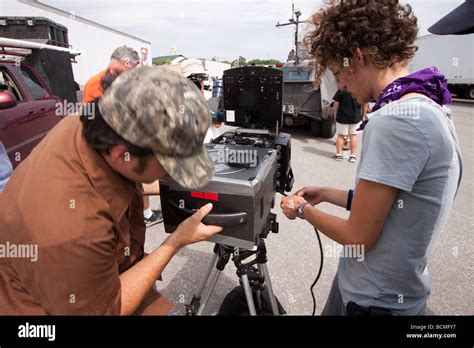 Sean Casey s IMAX team loads film into an IMAX camera during Project ...