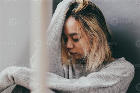 Depressed and sad young woman sitting alone at home 7196911 Stock Photo ...