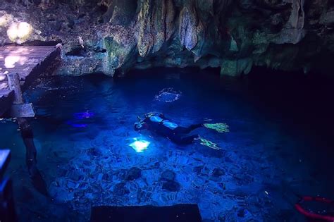 Premium Photo | Cave diving, diver underwater, dark cave, cavern landscape