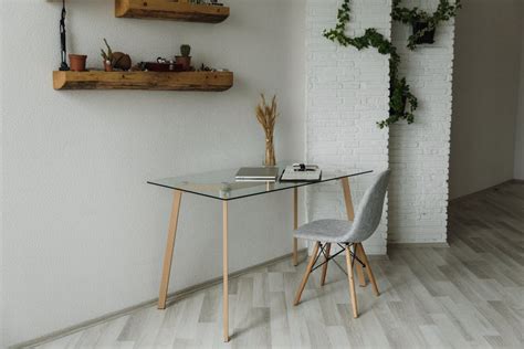 Round Brown Wooden Table Between Two Chairs and Ottoman Chair · Free Stock Photo