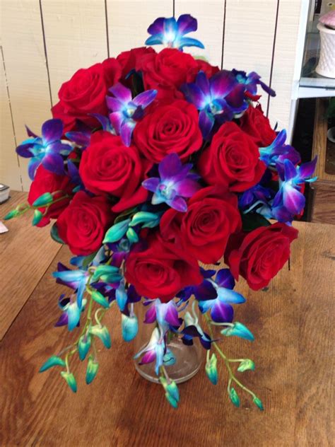 Freedom roses and blue bom orchids. Tear drop style bridal bouquet. | Bridal bouquet, Sympathy ...