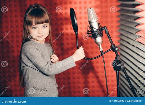 Awesome Little Girl Singing Songs in the Music Recording Studio Stock ...