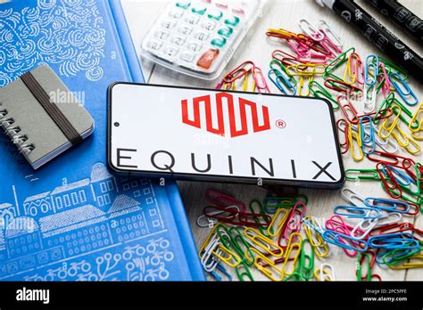 In this photo illustration a Equinix logo seen displayed on a smartphone Stock Photo - Alamy