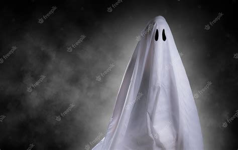 Premium Photo | Scary white ghost at big eye for halloween concept with clipping path