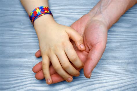 Autism Awareness Picture. Father Holding Hand Her Autistic Child Stock Photo - Image of ...