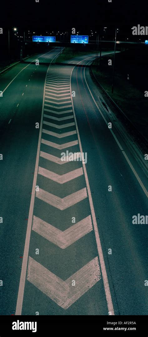 CHEVRON ROAD MARKING AT NIGHT UK Stock Photo - Alamy