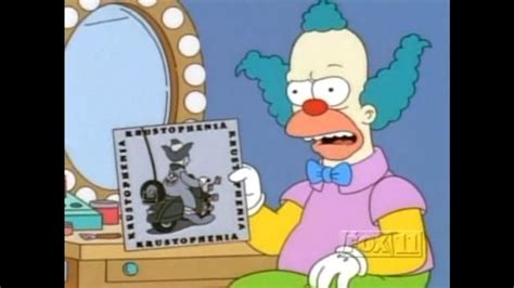 a cartoon character sitting in front of a mirror with an evil clown on it's face