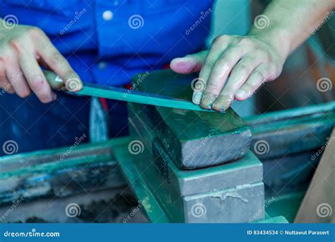 Sharpening Knife with a Whetstone Stock Photo - Image of equipment, antique: 83434534