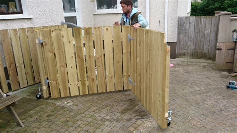 Bi-folding wooden gates - YouTube